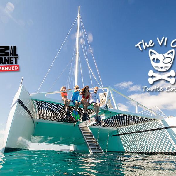 People sit on a catamaran with 'The VI Cat' logo and 'Animal Planet Recommended' text.