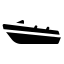 Silhouette of a small boat on water.